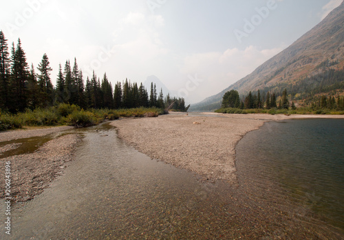 Upper Two Medicines Lake gravel stream near Sinopah Mountain in Glacier National Park during the 2017 fall fires in Montana United States
