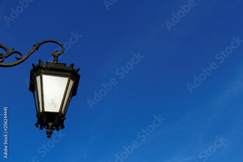 Vintage lantern on the street and blue sky