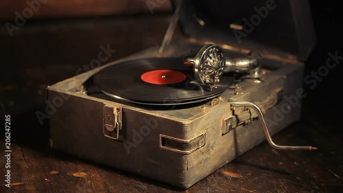 Playing vinyl records on a retro gramophone, potefone
