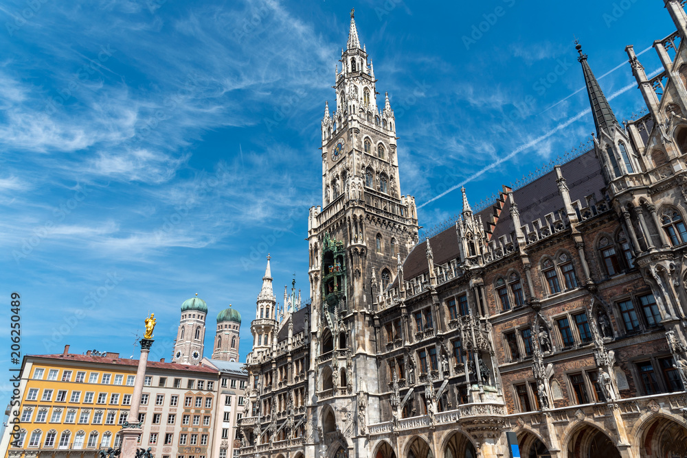 Naklejka premium The townhall at the Marienplatz in Munich with the towers of the Frauenkirche in the back