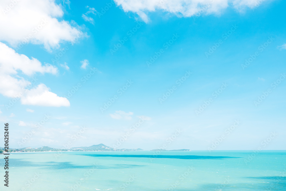 Beautiful white clouds on blue sky over calm sea background.