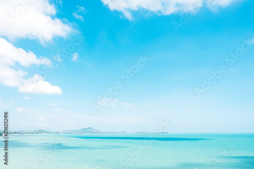 Beautiful white clouds on blue sky over calm sea background.