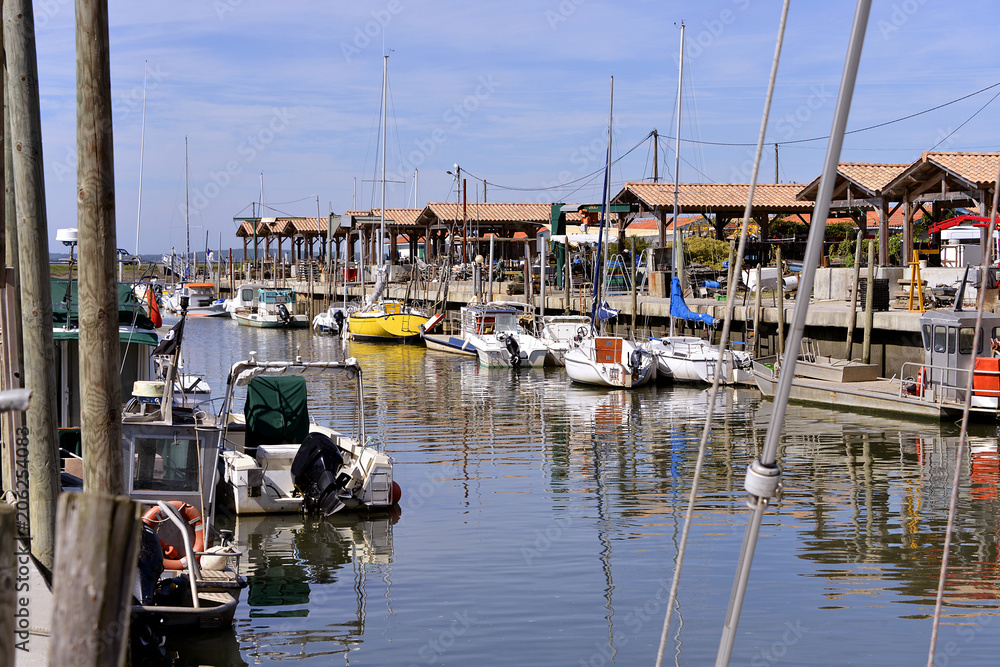 Ostreicole harbor of Andernos-les-bains, commune is a located on the northeast shore of Arcachon Bay, in the Gironde department in southwestern France. - obrazy, fototapety, plakaty 
