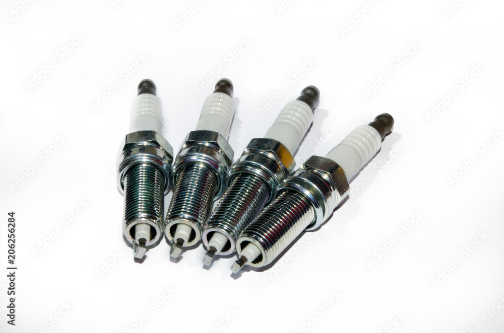 A spark plug is a device for igniting a fuel-air mixture in a wide variety of thermal engines. A set of spark plugs A spark plug is a device for igniting a fuel-air mixture in a wide variety of thermal engines. A set of spark plugs