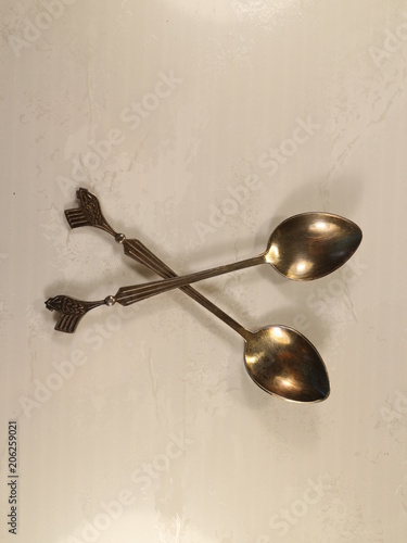 two metal teaspoons
