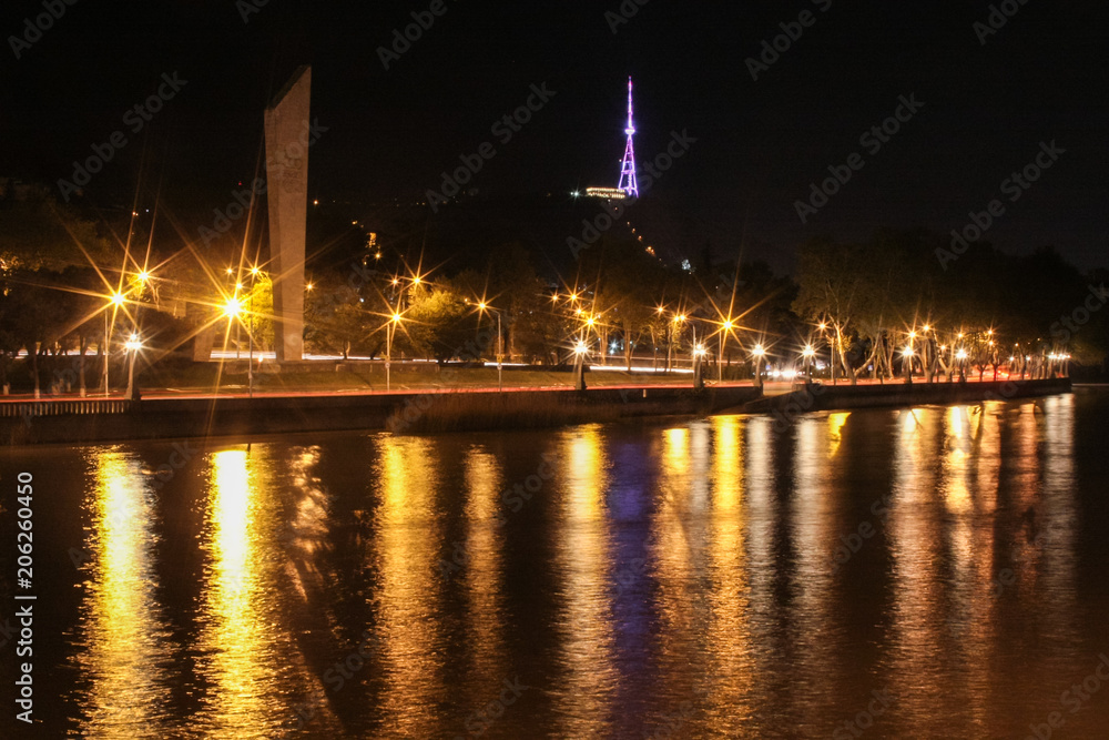 night view to tower, monument and river