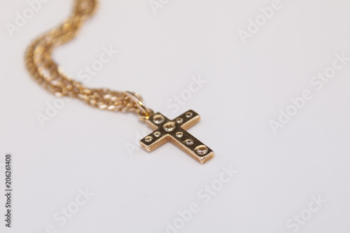 gold cross with diamonds
