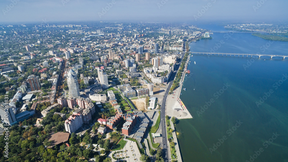 Obraz premium Bird's-eye view on the modern and well-groomed Ukrainian city of Dnieper (Dnipropetrovsk) located on the bank of the big river.