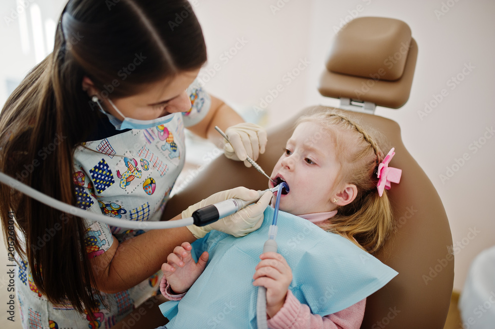 Little baby girl at dentist chair. Children dental. Little baby girl at dentist chair. Children dental.
