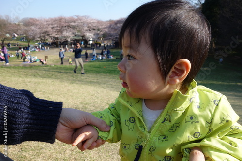 Baby holding at the park, 10 months old