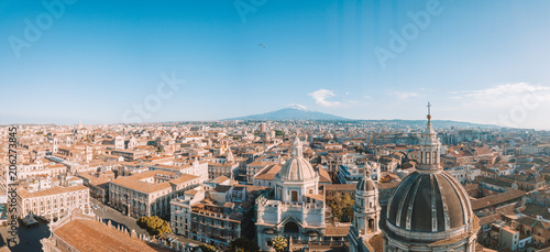 Fotografie, Obraz Aerial view of the Cathedral of Sant'Agata in the middle of Catania with Etna vo