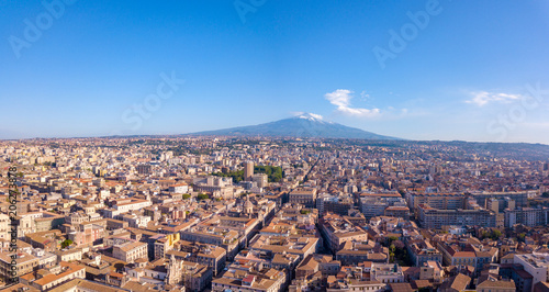 Beautiful aerial view of the Catania city on Sicily from above with Etna volcano visible on the horizon. photo