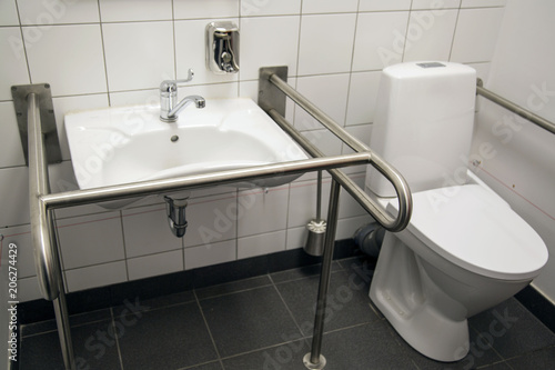 Slika na platnu Handicapped Access Bathroom with Grab Bars and a Toilet