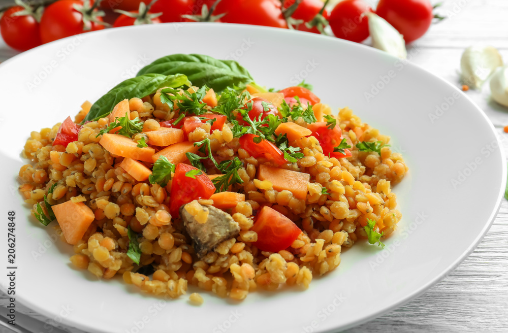 Plate with tasty lentil dish, closeup