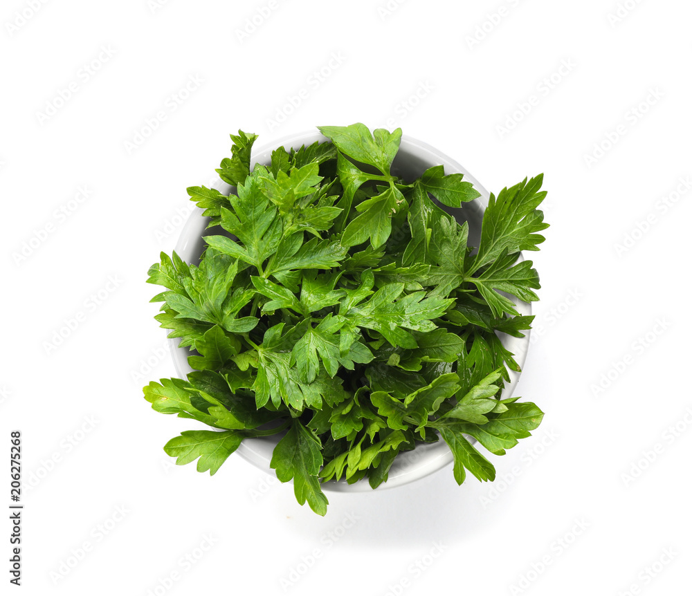 Obraz premium Bowl with fresh green parsley on white background, top view