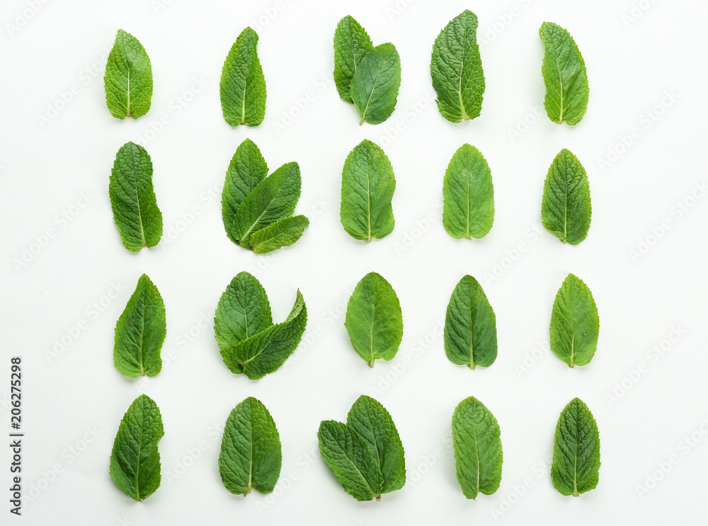 Flat lay composition with fresh mint leaves on white background Flat lay composition with fresh mint leaves on white background