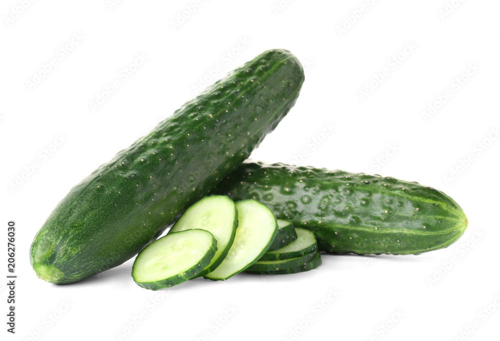Whole and sliced fresh cucumbers on white background Whole and sliced fresh cucumbers on white background