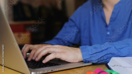 close-up view of young man hands typing text on laptop keyboard texting chat online internet surfing business people working using digital device application design network mesagge notification photo