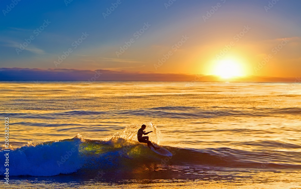 Sunset surfer at La Jolla, San Diego, California