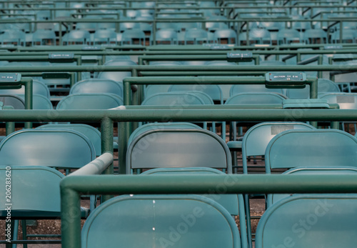 Empty Green Stadium Chairs at Horse Track © kellyvandellen