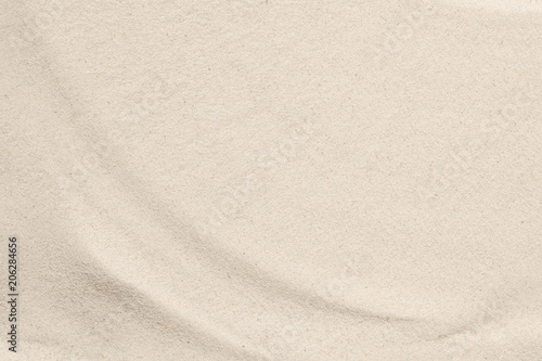 Beach sand texture background. Flat lay, top view, copy space 
