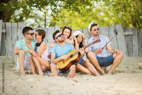 Young group of people outdoors on the beach © bokan