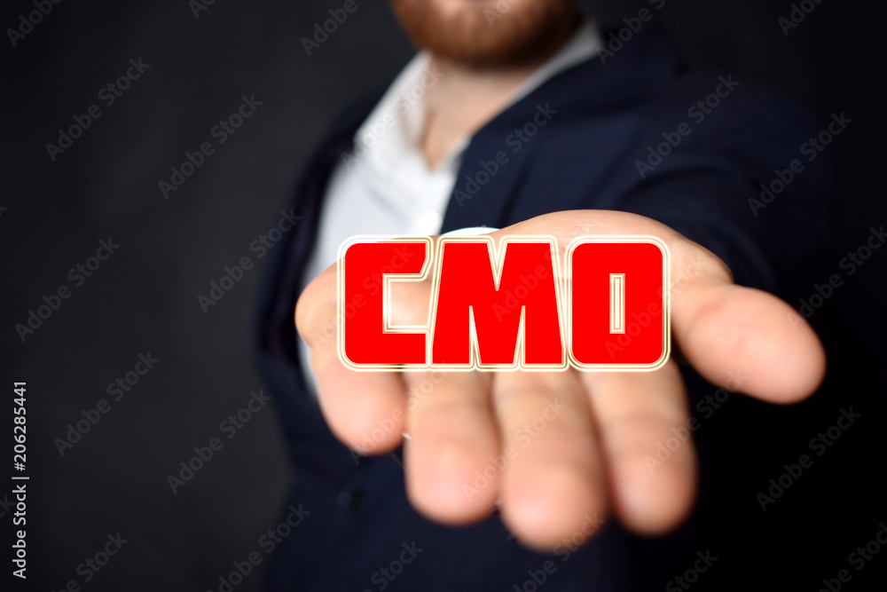 In the hands of a businessman the inscription:CMO In the hands of a businessman the inscription:CMO