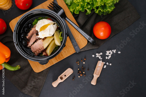 Close-up view of delicious dish in plastic bowl photo