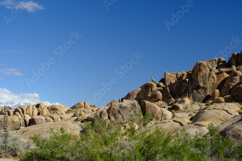 The Rugged and carved granite boulders of Alabama Hills in the desert near the Eastern Sierra Mountains and Mt Whitney Eastern California
