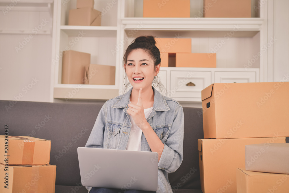 Sme business concept. Young Owner are packing their packages. Delivery business Small and Medium Enterprise(SMEs). Young Owner Start up for Business Online. Young are thinking about the business. Sme business concept. Young Owner are packing their packages. Delivery business Small and Medium Enterprise(SMEs). Young Owner Start up for Business Online. Young are thinking about the business.