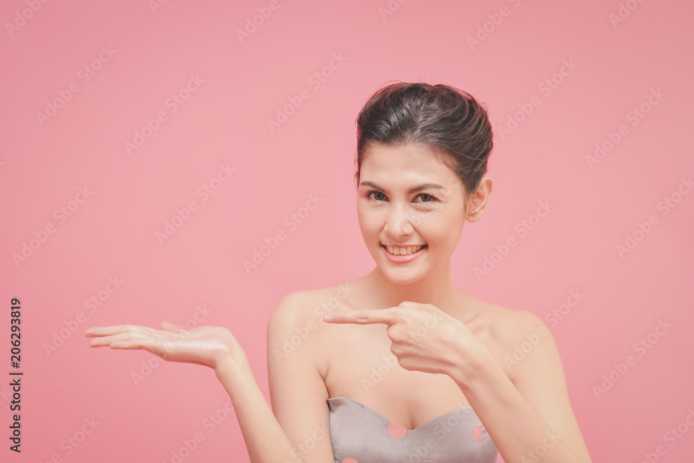 The concept of healthy beautiful woman. Beautiful women keep healthy. Beautiful women are present. Beautiful woman pointing fingers on white background. The concept of healthy beautiful woman. Beautiful women keep healthy. Beautiful women are present. Beautiful woman pointing fingers on white background.