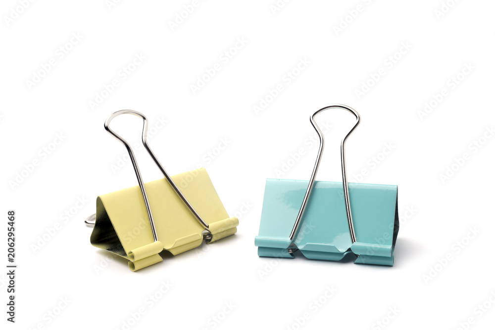 Yellow and blue Binder clip on a white background. Yellow and blue Binder clip on a white background.