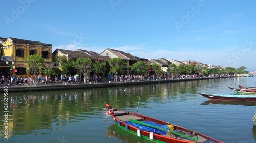 A sunny day at Hoai river with wooden boat. photo