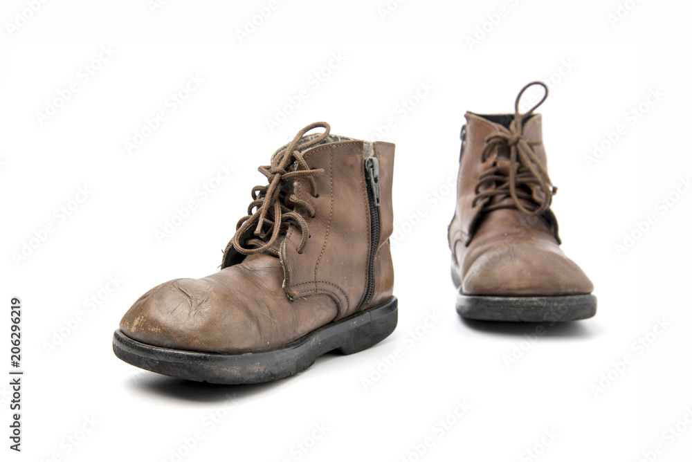 old brown boots isolated on a white background.