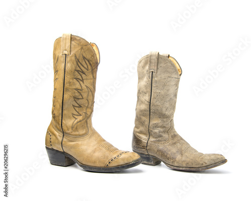 Brown cowboy boots isolated on a white background.