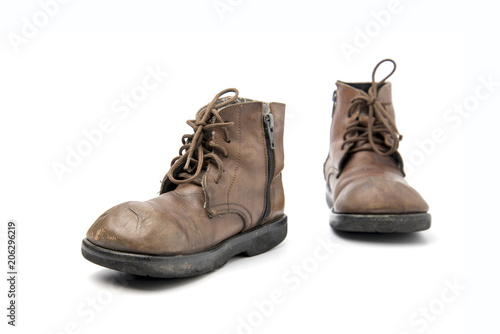 old brown boots isolated on a white background.