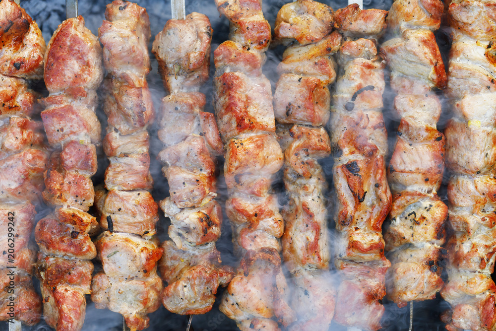 Shish kebab from pork. Background of cooked meat, top view Shish kebab from pork. Background of cooked meat, top view