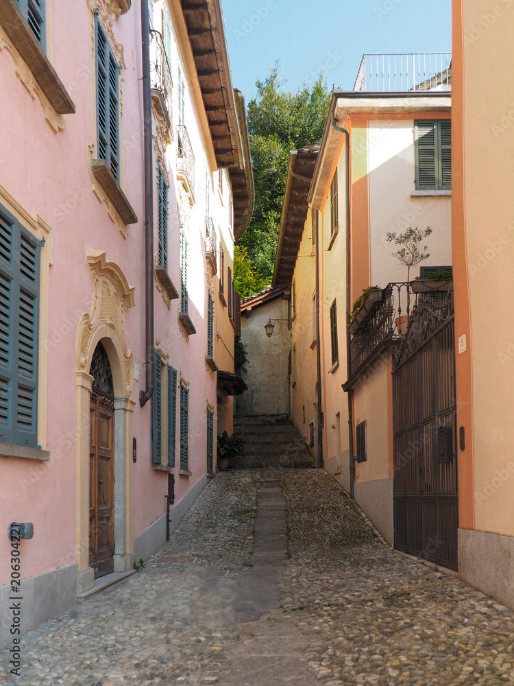 narrow cobbled street in Orta San Giulio, a beautiful Piedmontese village, Italy
