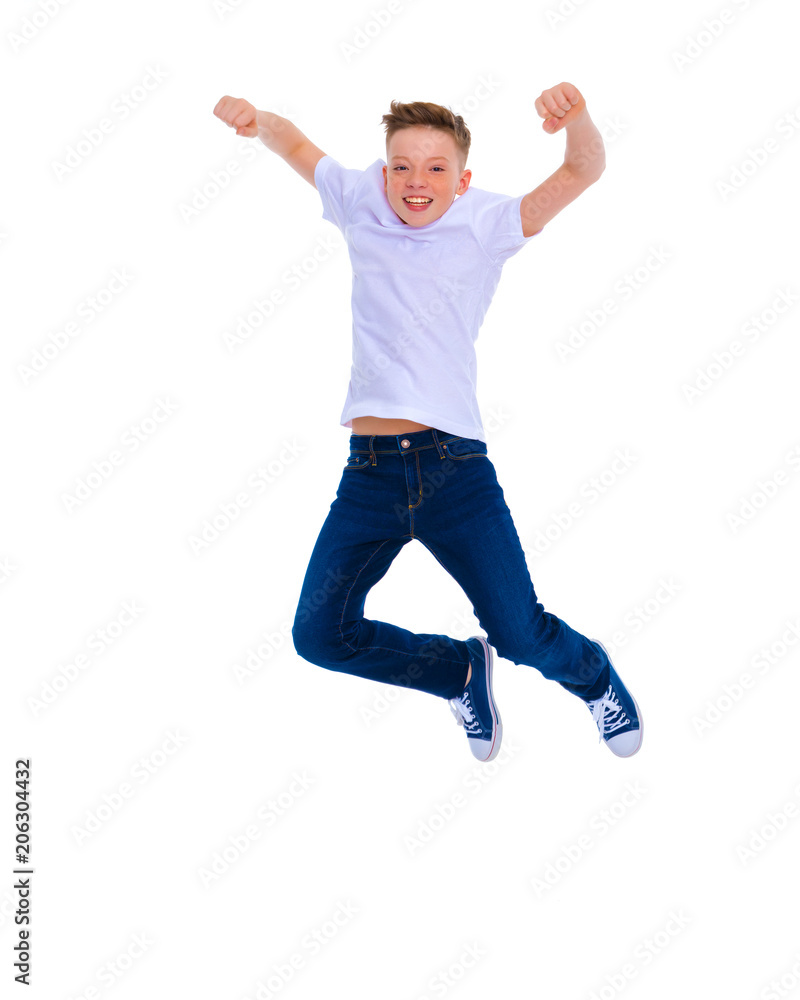 A little boy of school age jumps.