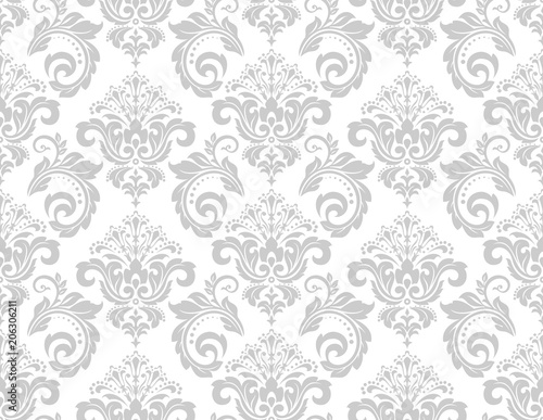 Wallpaper in the style of Baroque. A seamless vector background. White and grey floral ornament. Graphic pattern for fabric, wallpaper, packaging. Ornate Damask flower ornament.