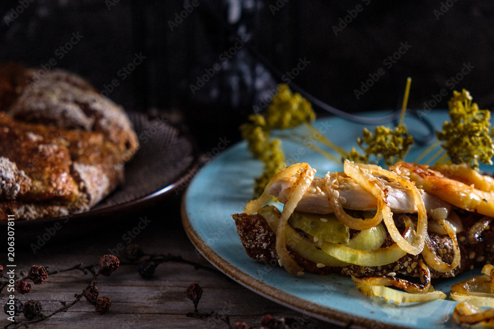 Fototapeta premium home sandwich with a hen and fried onion