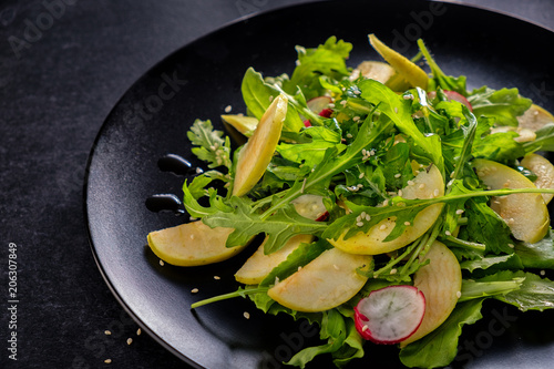 lettuce is spring with an apple spinach and radish