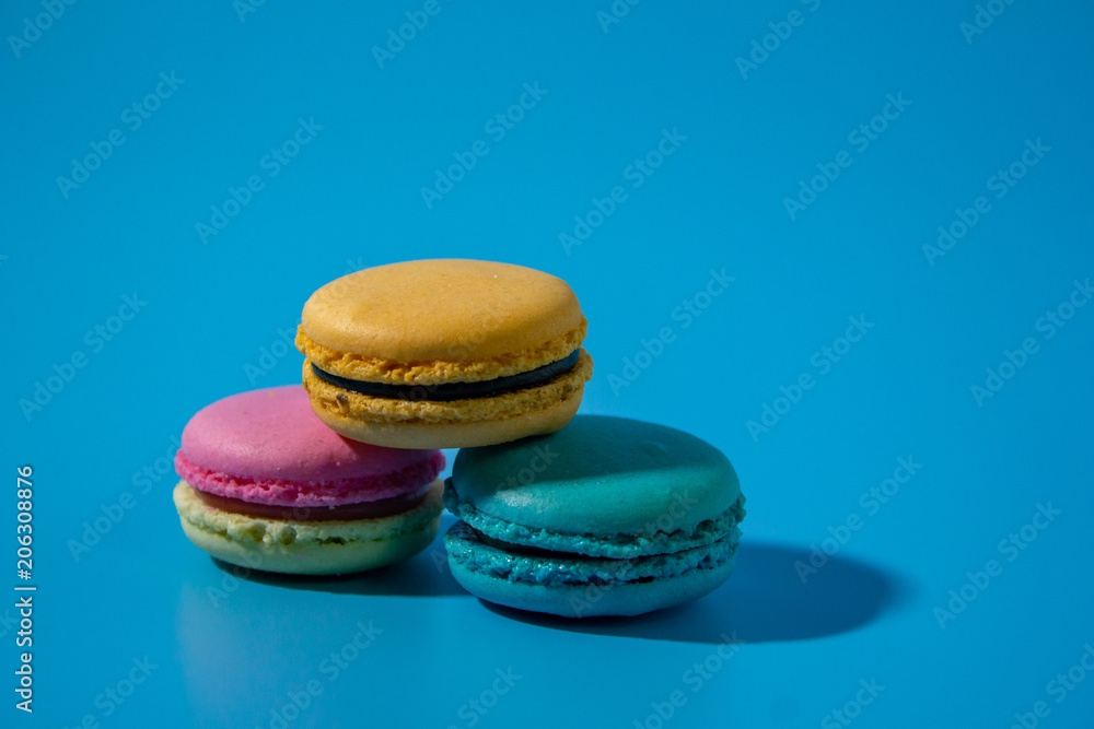 Macarons on cyan background clouseup. Macarons on cyan background clouseup.