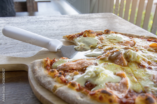 Slice of hot pizza large cheese with bell pepper vegetables delicious tasty fast food Italian traditional on wooden board photo