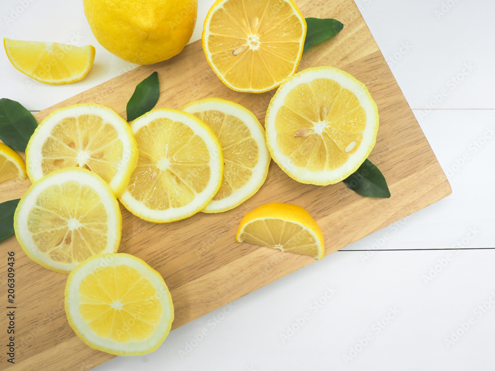 Fresh lemon slice on white wood background Fresh lemon slice on white wood background