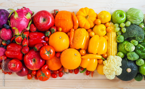 Colorful fresh fruits and vegetables on wood background  healthy eating concept.