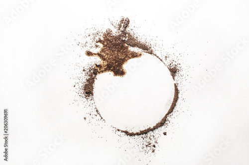 Spilled coffee isolated on white background looks like a sign of aliens who want to communicate. A sign-call to communicate. Why are they here?