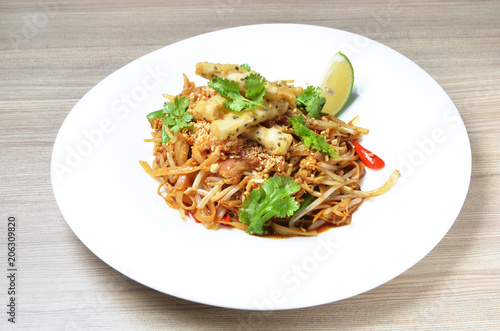  Thai style stir fried rice noodle on white plate. 
