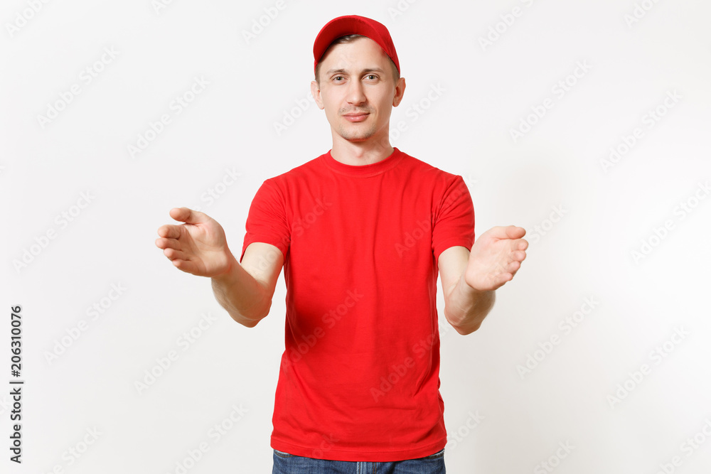 Delivery man in red uniform isolated on white background. Professional male in cap, t-shirt working as courier or dealer holding virtual object. Spreading hands gesture. Copy space for advertisement. Delivery man in red uniform isolated on white background. Professional male in cap, t-shirt working as courier or dealer holding virtual object. Spreading hands gesture. Copy space for advertisement.