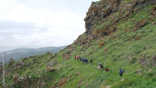 Tourist Group Visits Armenian Cliff at Gndevank Canyon, Armenia 1  photo